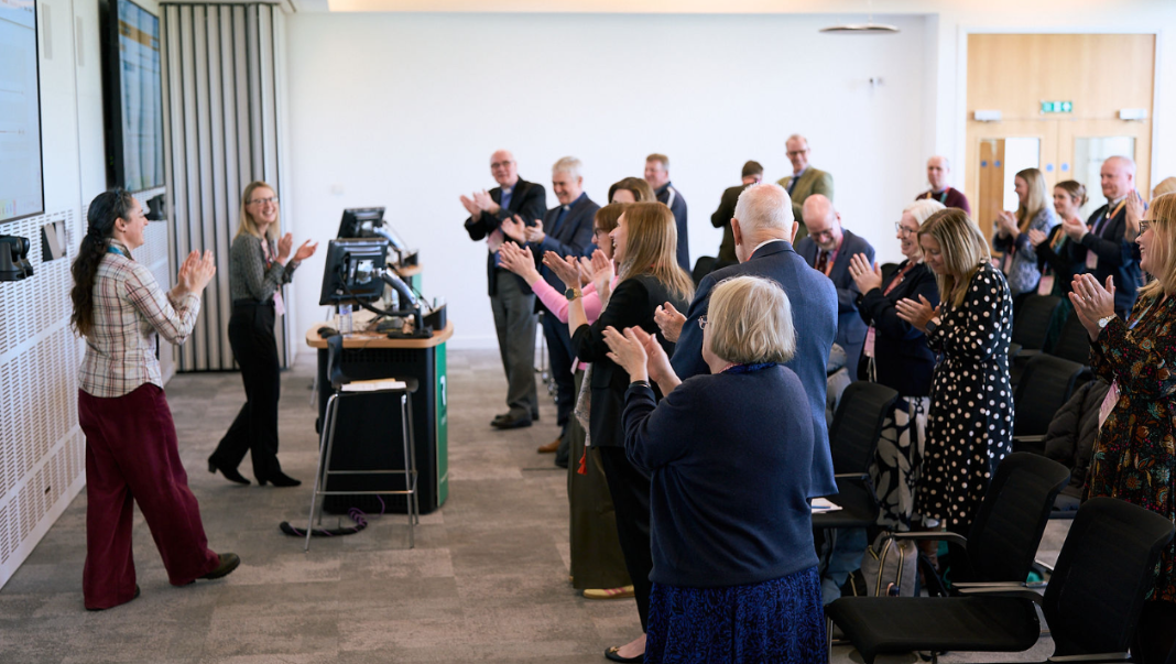 Conference attendees join in dance and song with presenters from Fischy Music.
