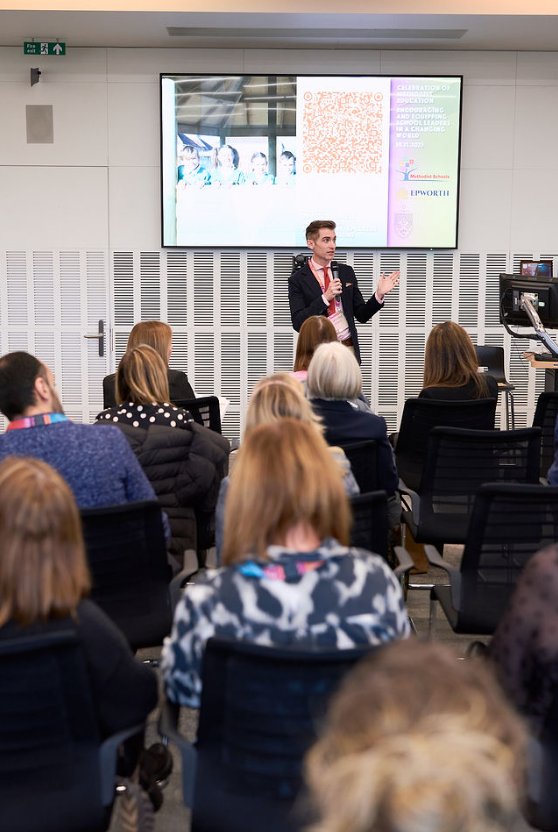 Christopher Stephens welcomes attendees to the Celebration of Methodist Education conference